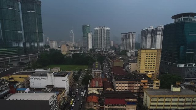 Zoom out timelapse of the city of Kuala Lumpur during rainy day FHD