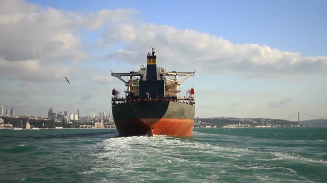 Big ship view from the stern at sea. Back view of a 290 meters long oil tanker ship on route to Black Sea. Bosphorus Starits in Istanbul, Turkey