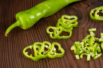 Green hot Chili pepper on a wooden board