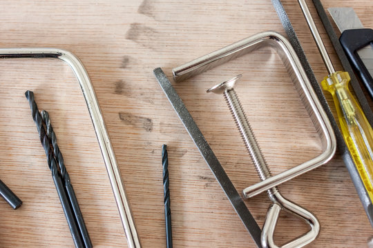 tools in workshop on wooden background