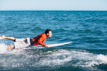 Portrait of young surfer standing 