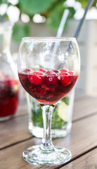 Glass with lemonade on a wooden table