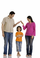 Fototapeta premium Man and woman with their daughter 