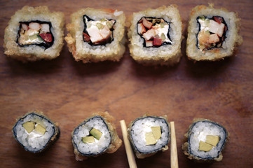 Japanese sushi rolls on a wooden stand. Japanese food.
