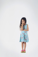 Portrait of little girl standing