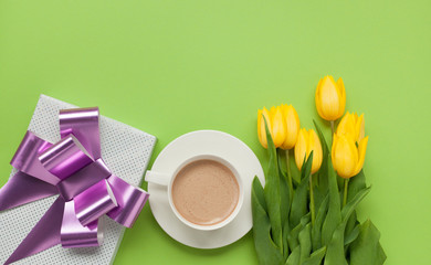 Coffee with giftbox and flowers from above