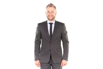 Portrait of middle-aged businessman in elegant suit posing against white background