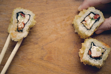 Japanese sushi rolls on a wooden stand. Japanese food.