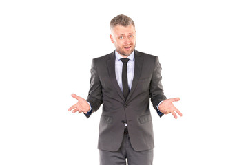 Portrait of middle-aged businessman in elegant suit posing against white background