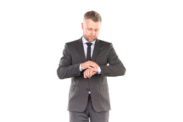 Portrait of middle-aged businessman in elegant suit posing against white background