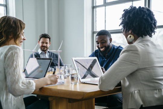 Smiling Business People During Meeting In Office