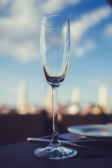 Empty glass wineglass on the sky background
