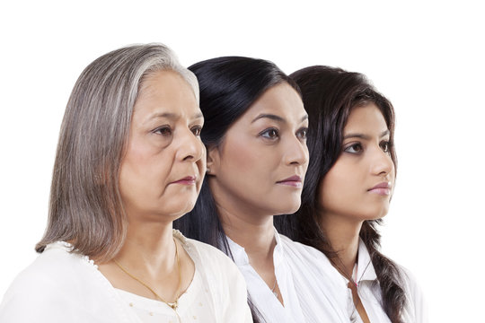 Multi-generation family over white background 