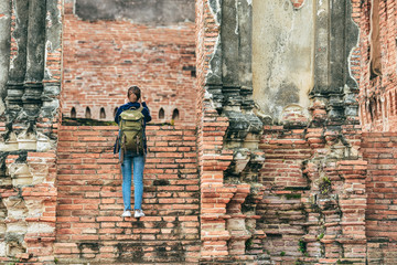 Fototapeta na wymiar Young asian traveller enjoying a looking at Buddhist stupas in thailand asia. Burma Asia. Traveling along Asia active lifestyle tourist thailand concept