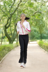 Young woman jogging in park 