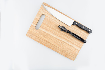 Top view knife, fruit peeler knife and cutting board