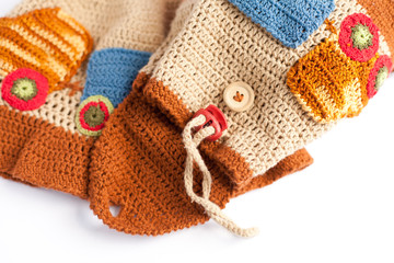 Handmade knitted backpack and a hat for a child 