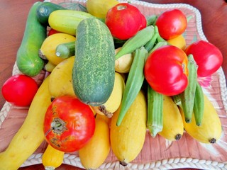 Summer vegetables, cucumbers, squash, okra and tomatoes