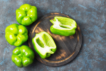 Sweet peppers on concrete background. Top view, space for text.
