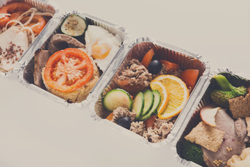 Healthy meals in boxes, diet concept. Meat with garnish and vege