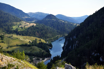 Fototapeta na wymiar Beautiful lake with surrounding forests