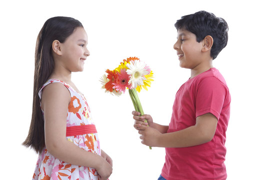 Boy Giving Flowers To A Girl