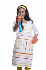 Portrait of a woman with cleaning liquid