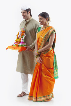 Maharashtrian couple with a Ganesh idol