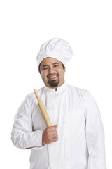 Portrait of chef holding a rolling pin
