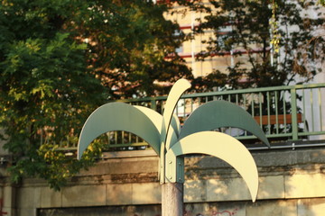 Fototapeta na wymiar urban palm tree metal golden hour close up
