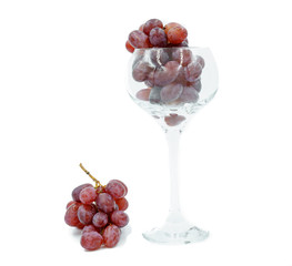Wineglass with a bunch of grapes