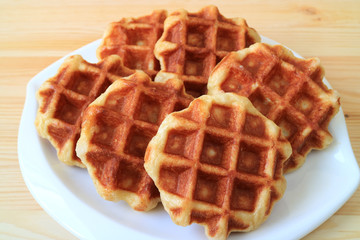 Delectable Belgian Waffles on White Plate Served on Wooden Table 