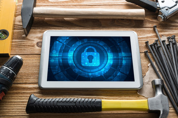 Web security and technology concept with tablet pc on wooden table © adam121
