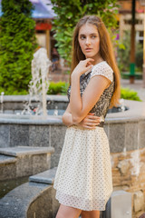 Portrait of beautiful young woman wearing in a dress