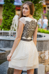 Portrait of beautiful young woman wearing in a dress