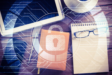 Business workplace with tablet pc and security concept on screen