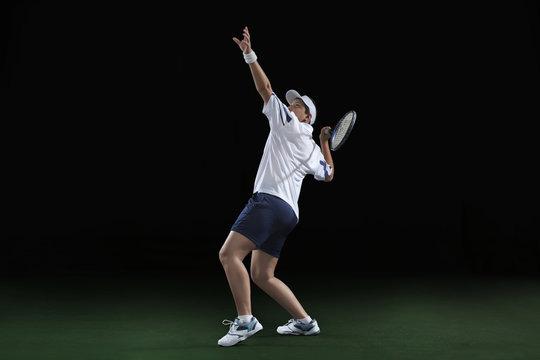 An Indian female player playing tennis against black background