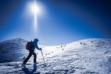 Winter sport for one, Tourist on trip in snowy mountains, Background winter sport, Symbol of winter sports in mountains, Skialpinist on snowy mountains