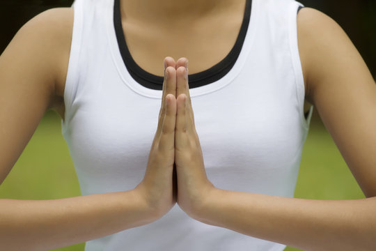 Close-up of woman's hands in prayer position 