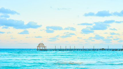 Exotic Beach, Paradise - Travel, Tourism and Vacations Concept. Landscape of Tropical Resort. Jetty near Cancun, Mexico