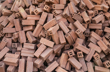 stack of red clay bricks for construction site