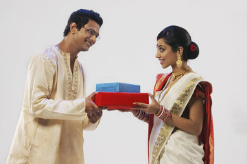 Bengali couple holding gifts 