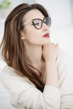 pensive woman in glasses