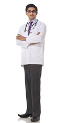 Full length of confident doctor standing over white background 