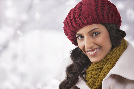 Close-up portrait of young woman in warm clothes 