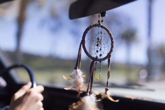 Close up of dreamcatcher hanging in the car