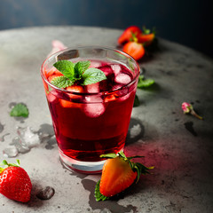 Fresh strawberry and mint drink on grey background