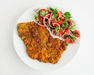 schnitzel of beef with juicy summer salad