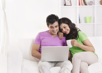 Fototapeta premium Couple sitting with laptop