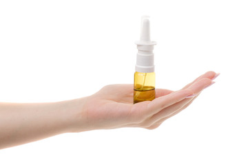 Spray for nose in female hand
